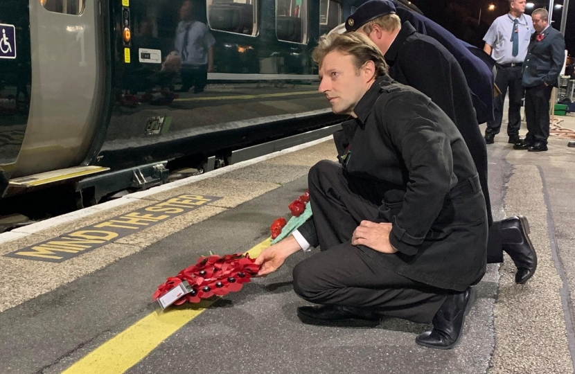 Derek lays a wreath