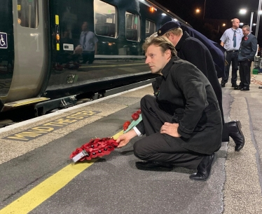 Derek lays a wreath